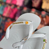 Havaianas Top +  Placa Logo + Pin Sol e Água de Coco
