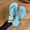 Havaianas Aura + Pin Conha e Estrela Marrom